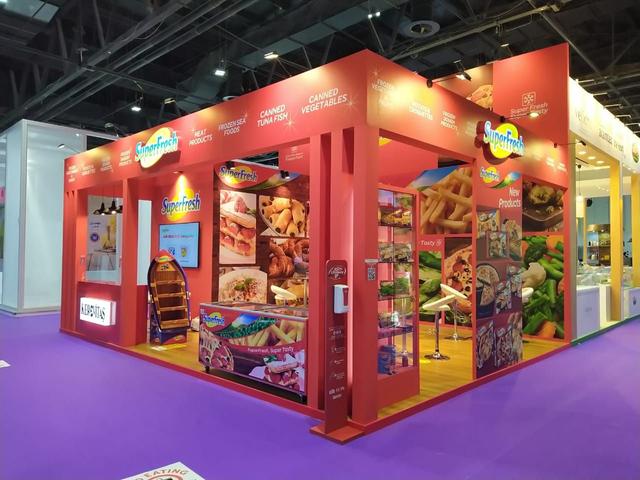 High-impact food exhibition stand design, built to showcase frozen and packaged food products with strong visual branding and sampling areas.