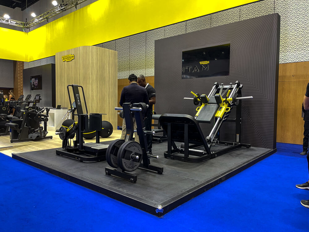 Custom exhibition stand design for WikiFX, featuring branded graphics, meeting space, and high-visibility layout